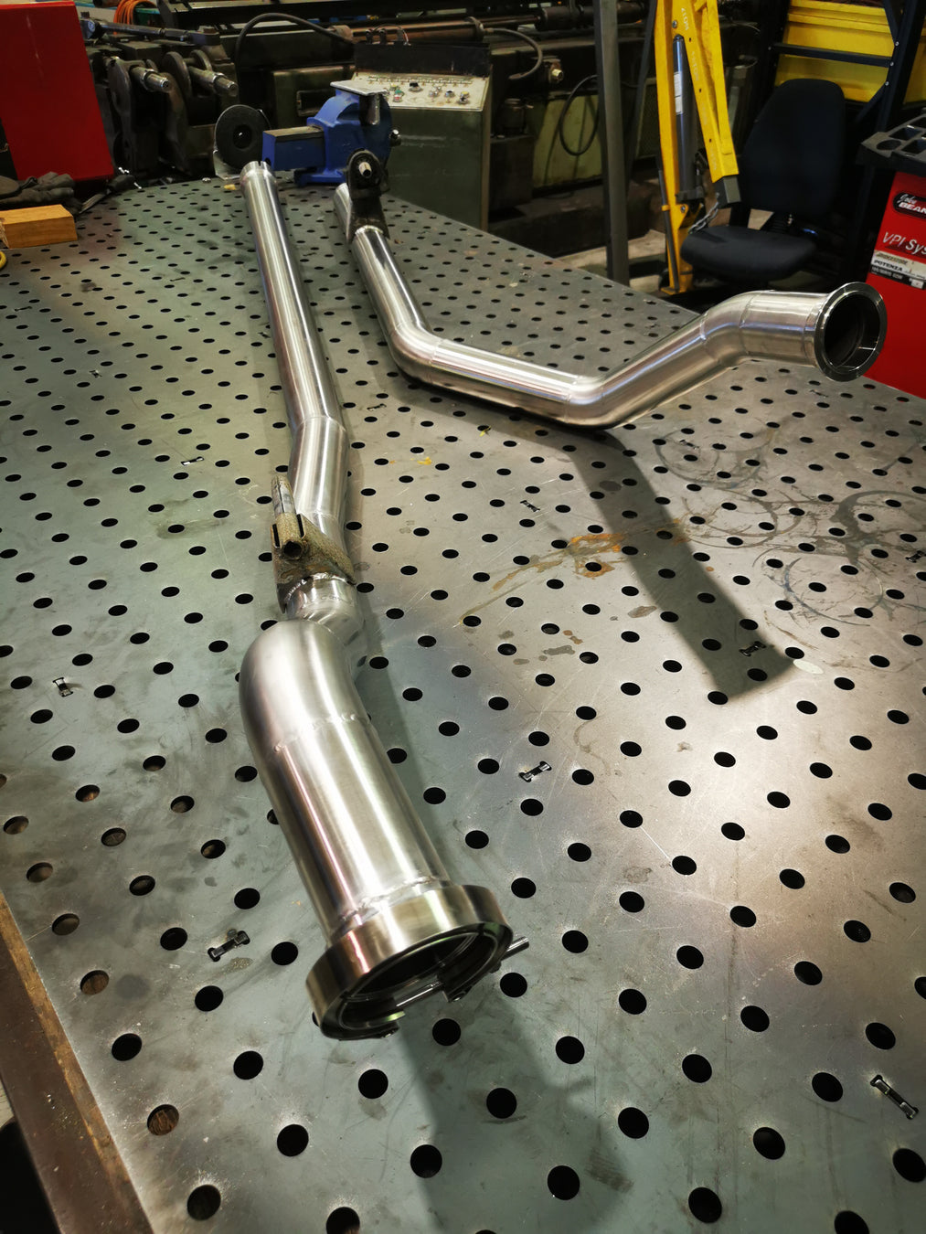 Stainless steel full exhaust buld sitting on welding table finished product from mount marine engineering