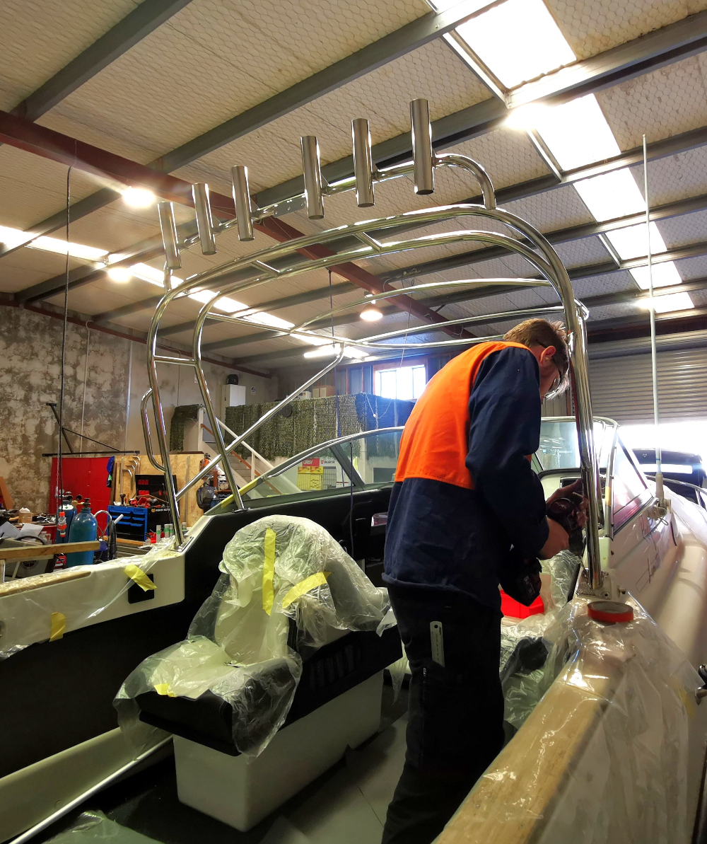 stainless steel softtop getting installed by mount marine engineering