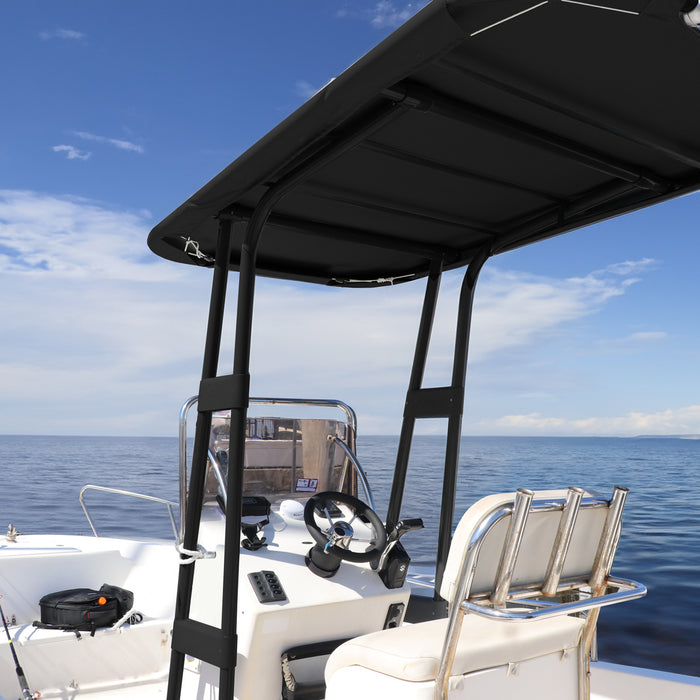 A black T-top canopy installed on a boat, providing shade and protection from the sun for the captain and passengers. The boat is docked at a marina with a clear blue sky and calm water in the background.