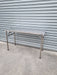 Stainless Steel Folding Table In front of roller door