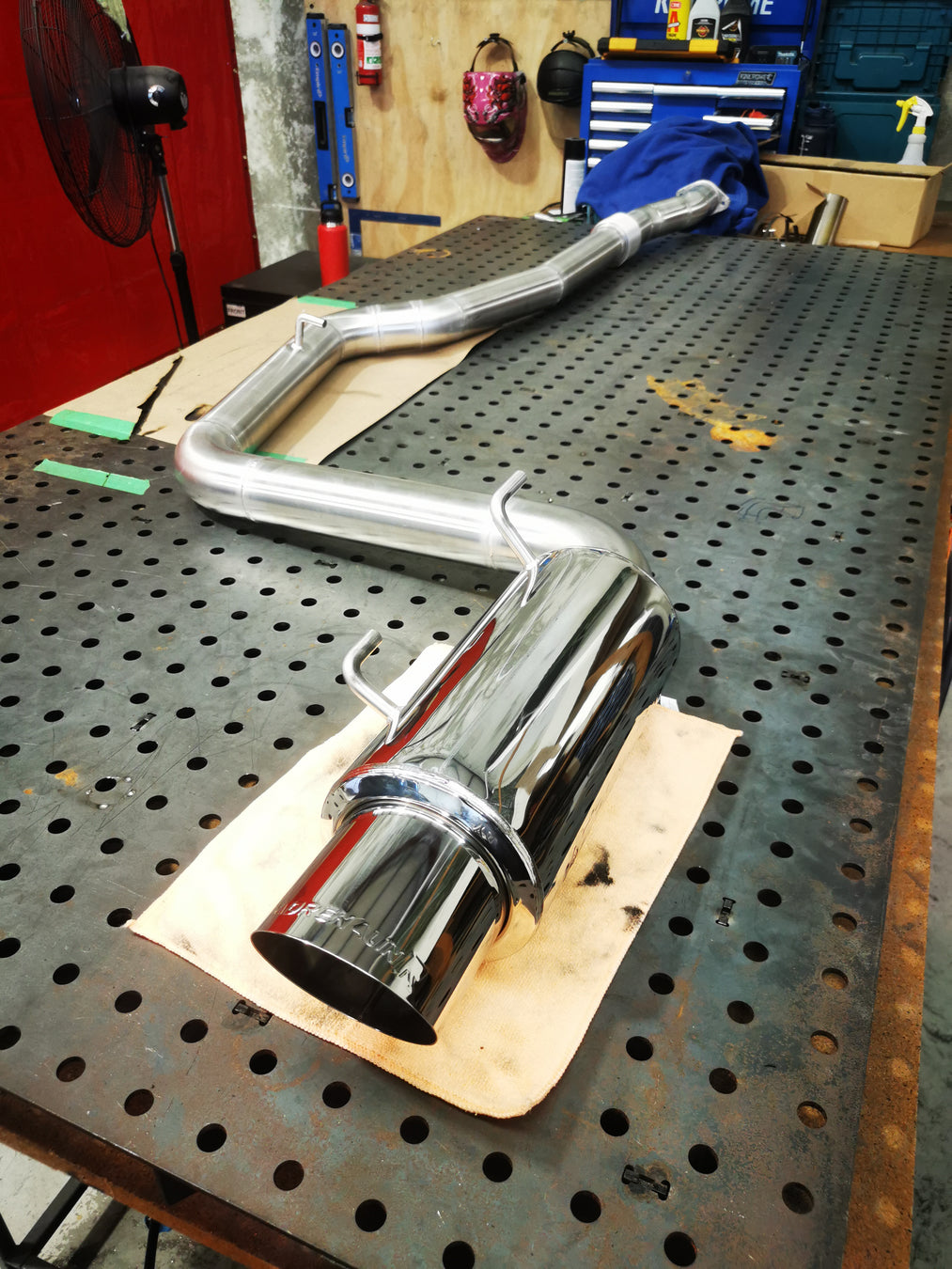 stainless steel exhause on a welding bench for a subaru