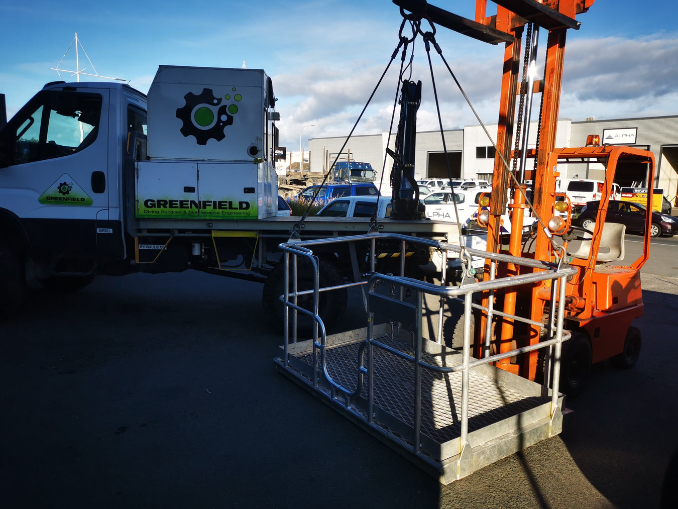 aluminium diving cage being loaded onto a truck